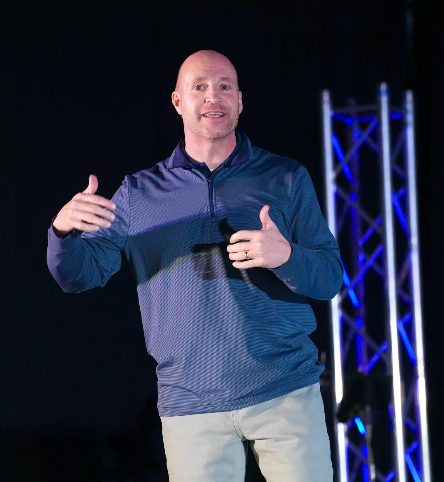 Jason Williams speaking on stage during a Sunday service